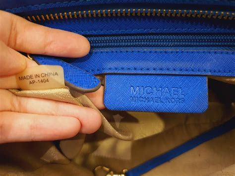 real vs fake michael kors sales tag|michael kors purses serial number.